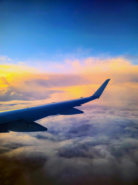 Above the Clouds: Flying into the Sunrise Print