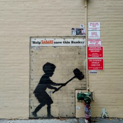 Banksy on Broadway Boy Hammering Hydrant